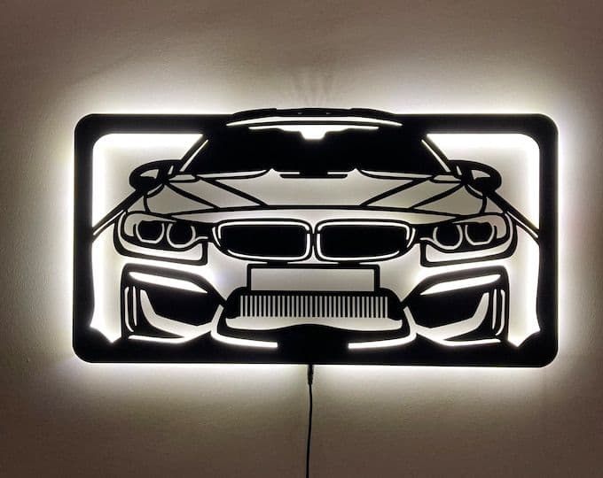 Metal Car Art wall set, arranged on a wall
